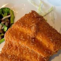 Salmon Katsu With Rice · Dipped in a light bread crumb batter, then deep fried to perfection.