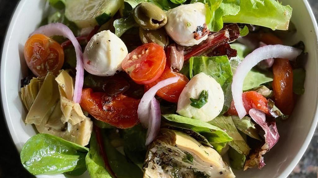 Limoncello Tossed Salad · spring mix, olives, red onions, cucumber, cherry tomato, marinated artichoke, roasted red peppers, baby fresh mozzarella, basil white balsamic vinaigrette