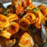 Pescatore · lobster tail, shrimp, calamari, mussels, clams over linguine. choice of sauce