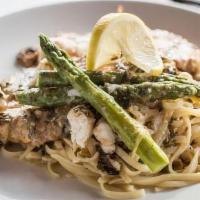 Chicken Limoncello · egg-dipped chicken, asparagus, lump crab, lemon, white wine sauce served with pasta or veget...