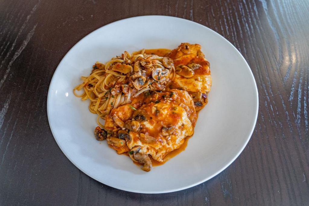 Chicken Saltimbocca · chicken breast topped with parma prosciutto, fresh mozzarella, kennett square mushrooms, white wine marinara sauce, served with pasta or vegetable of the day