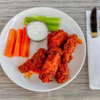Chicken Wings · Your Choice of Buffalo, Honey Bourbon BBQ or Sweet Garlic Sauce, served with Bleu Cheese Dre...