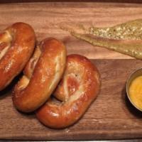 Soft Pretzel · Large Soft Pretzel Served with Cheese Sauce & Whole Grain Mustard