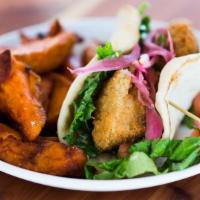 Falafel On Pita (Dinner) · Fried falafel with pickled red onions, lettuce, cucumbers, tomatoes, and tzatziki sauce. Ser...