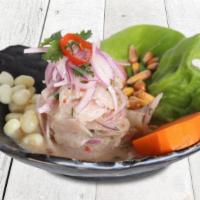 Ceviche De Pescado · Fresh fish marinated in fresh lime juice, mixed with 