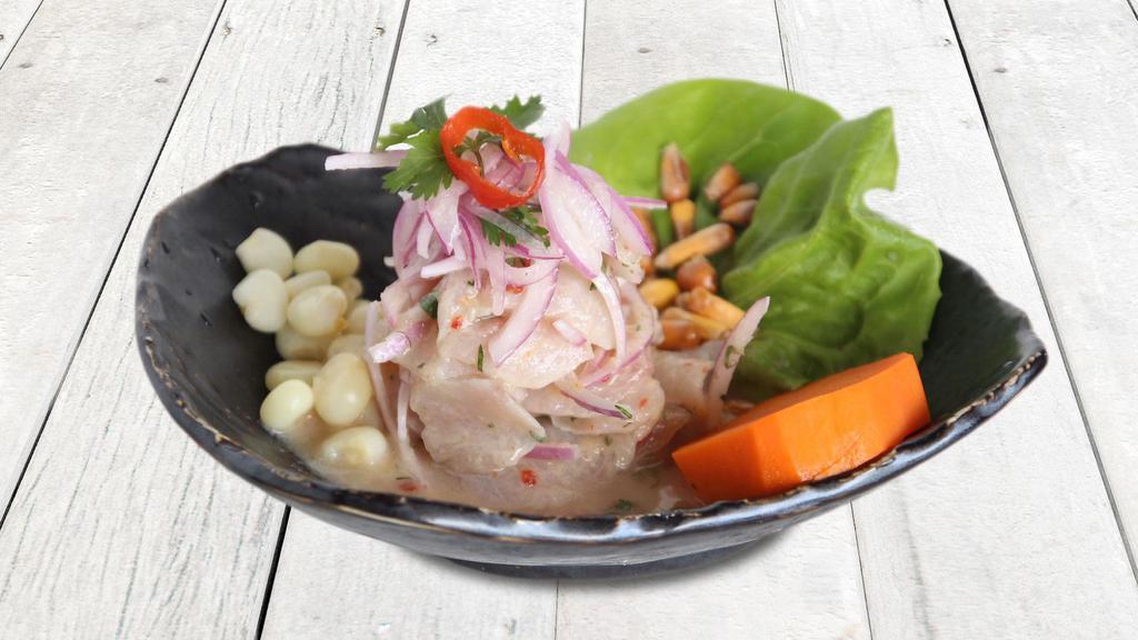 Ceviche De Pescado · Fresh fish marinated in fresh lime juice, mixed with 
