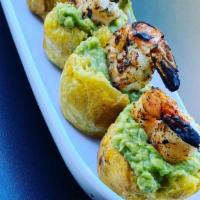 Shrimp Plantain Guacamole Bites · Marinated shrimp served atop handcrafted plantain cups, stuffed with freshly made guacamole.