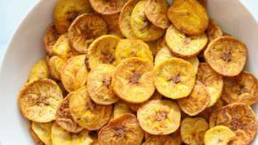Golden Plantain Chips With Fried Cheese · Thinly sliced plantains fried until golden, alongside sticks of fried Dominican cheese. Serv...