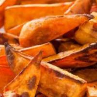 Caribbean Potato Wedges · Freshly cut russet potatoes cooked to perfection. Topped with ketchup and our signature sofr...