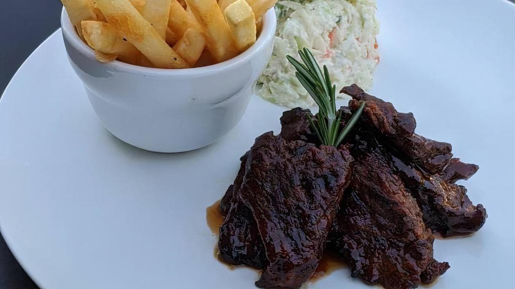 Bbq Marinated Steak Tips · Half pound marinated steak tips, based with our house BBQ, hand-trimmed and fire-grilled to order. Served with coleslaw and hand-cut fries.