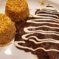 Enchiladas · Three soft corn tortillas topped with cheese, sour cream and the sauce of your choice of mol...