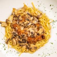 Chicken Piccata · Chicken cutlet sautéed in lemon butter and wine sauce, finished with fresh mushrooms over yo...