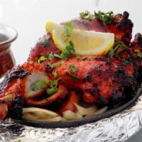 Chicken Tandoori · Chicken (with bones) marinated in yogurt and spices and grilled in clay oven.