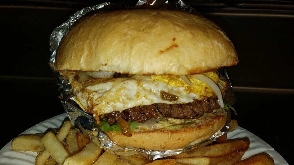 Signature Burger · 1/2 lb. Fried egg, topped with three bacon strips, grilled jalapeño peppers and covered with American cheese.