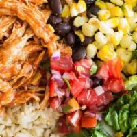 Pulled Chicken Burrito Bowl · Pulled chicken over Mexican rice, black beans, and salsa.