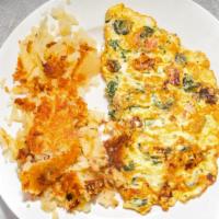 Sausage Omelette · Omelettes are made with three eggs and served with fried potatoes.