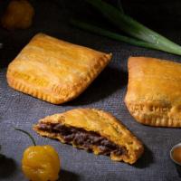 Beef Pattie · Seasoned ground beef spiced with Jamaican seasoning inside a golden pastry crust.