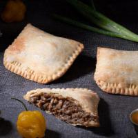 Jerk Chicken Pattie · Jerk chicken made with our signature sauce in a flaky turnover. Serves 1