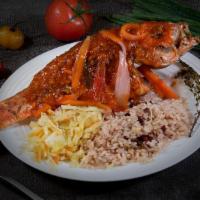 Brown Stew Fish Dinner · Entree: **popular dish**  whole red snapper fried and then stewed in tomato based sauce serv...