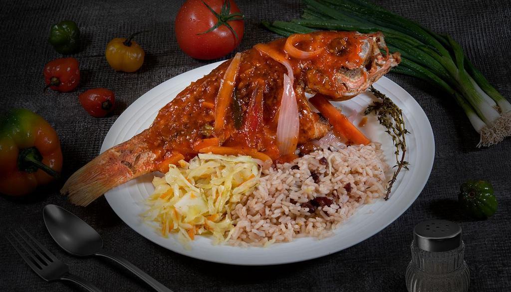Brown Stew Fish Dinner · Entree: **popular dish**  whole red snapper fried and then stewed in tomato based sauce served with rice and peas & cabbage in a separate container