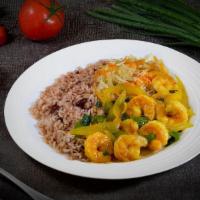 Curried Shrimp Dinner · Shrimp marinated in our Jamaican curry blend with onions, tomatoes, and green peppers, serve...