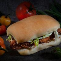 Perch Fish Sandwich · Breaded Perch fillet on our coco bread with lettuce, Swiss cheese, and our scotch bonnet aio...