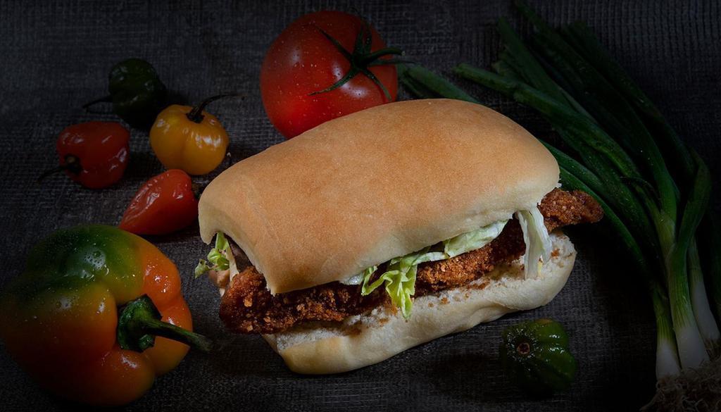 Perch Fish Sandwich · Breaded Perch fillet on our coco bread with lettuce, Swiss cheese, and our scotch bonnet aioli.