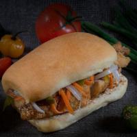Snapper Escoveitch Sandwich · Seasoned Red Snapper fish fillet on our coco bread with our escoveitch sauce (onions, pepper...