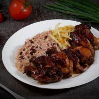 Jerk Drumettes Dinner · Jerk chicken wings (7) made with our signature spices and sauce, on rice & peas and cabbage.
