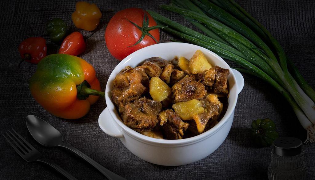 Side Curry Goat · Goat morsels simmered in our special curry blend.