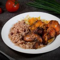 Fricasse Chicken (Brown Stew)  Dinner · Chicken in our brown stew sauce with the complexity of savory and sweet, on rice & peas and ...
