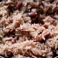 Rice & Peas · Red beans and rice cooked in coconut, herbs and spices, served with cabbage.