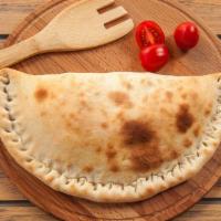 Chicken Bacon Ranch Calzone · Fresh calzone dough filled with chicken, sizzling bacon and ranch.