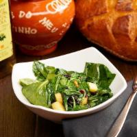 Espinacas A La Catalana · Sautéed Spinach with Pine Nuts, Apples and Raisins