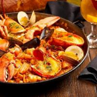 Paella Bogavante · Seafood Paella with Monkfish, Clams,. Mussels, Squid, Scallops, Shrimp & Lobster