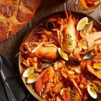 Individual Marinera Con Bogavante · Seafood Paella with Monkfish, Clams, . Mussels, Squid, Scallops, Shrimp & Lobster
