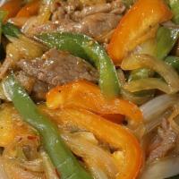 Mongolian Beef · Hot and spicy. Sliced beef, onion, scallions, black pepper spicy in Mongolian sauce.