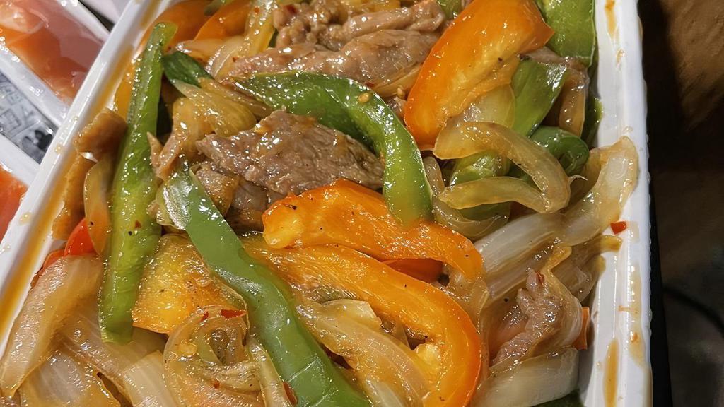 Mongolian Beef · Hot and spicy. Sliced beef, onion, scallions, black pepper spicy in Mongolian sauce.