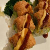 Rock Roll · Shrimp tempura and avocado on the top, spicy tuna over top and served with eel sauce.