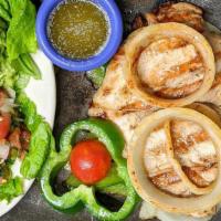 Pechuga De Pollo · Tender grilled chicken breast marinated in Mexican herbs.