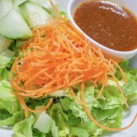 Sea Lion House Salad · Iceberg lettuce, carrot, and cucumber with ginger dressing.