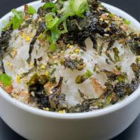Seasoning Rice  · seasoning white rice with roasted seaweed and scallions on top.
