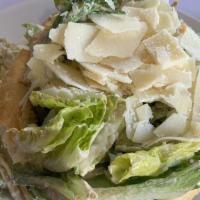 Caesar · Romaine lettuce, homemade Caesar dressing and Parmesan Reggiano cheese.