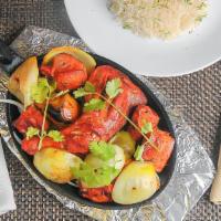 Sweets & Curry House Mixed Grill · Tandoori chicken, chicken tikka, shish kebab, lamb tikka, onion, peppers and tomatoes, marin...
