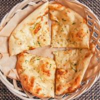 Garlic Naan · Unleavened bread with fresh garlic and coriander.