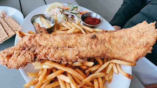 Fish & Chips · lightly fried haddock,battered or dry with house pickles, fries, cole slaw and choice of sauce.