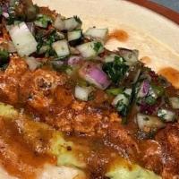 Fundido Chorizo Taco · Oaxaca cheese, salsa quemada, avocado, onion, cilantro