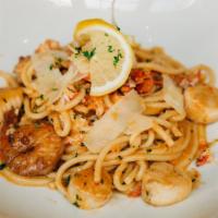 Seafood Scampi · shrimp, scallops, lobster, lemon, white wine & garlic sauce, sundried tomato pesto, bucatini...