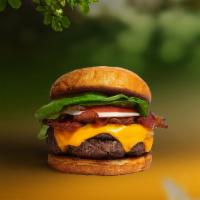 Bacon Beacon Vegan Burger · Seasoned plant-based patty topped with melted vegan cheese, layers of crispy vegan bacon, le...