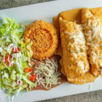 Fried Or Soft Chimichanga · Filled with grilled vegetables, topped with cheese dip and salad. Served with rice.